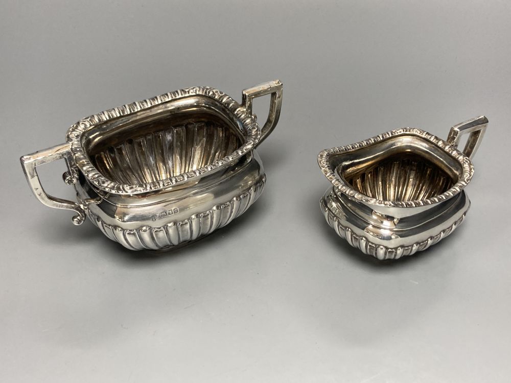 A George V demi fluted silver four piece tea set by Charles Boyton & Son Ltd, London 1918 and 1922,